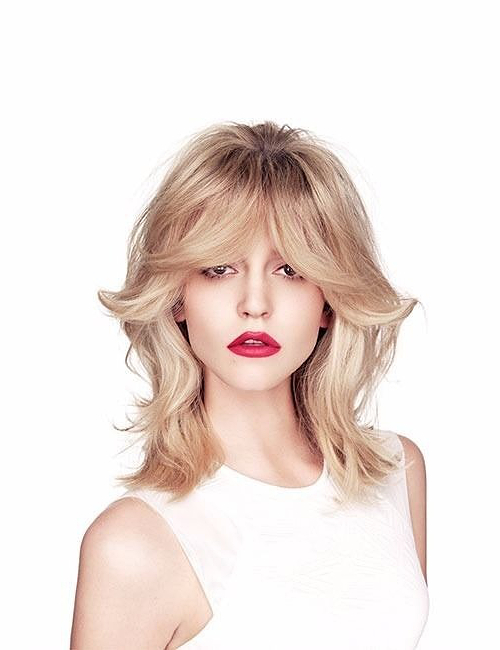 Hair salons in Dubai and Abu Dhabi- glamourous blonde wavy hair